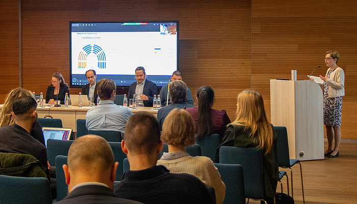 Audience and panelists during a discussion