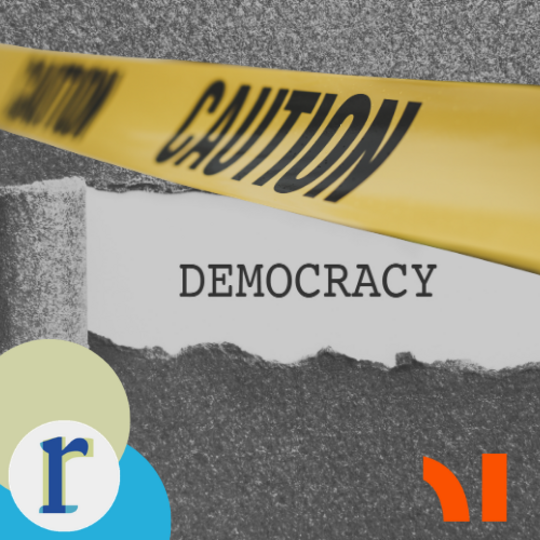 Yellow caution tape reading "CAUTION" stretched across torn paper revealing the word "DEMOCRACY" underneath.