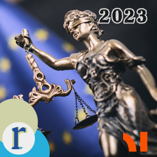 A bronze statue of a blindfolded Lady Justice holding a set of scales, against a blue backdrop scattered with gold stars, next to the bold text "2023".