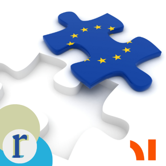A jigsaw puzzle piece painted with the EU flag's circle of gold stars, lifted out of a white puzzle background.