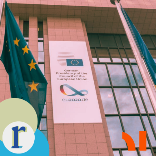 The exterior of an EU building with EU flags flying, and a banner reading "German Presidency of the Council of the European Union,